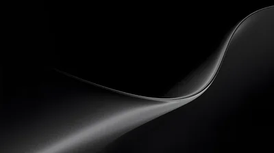 A single pale ribbon curves in from the right edge and thins out toward the lower left, the rest of the frame left in deep black.