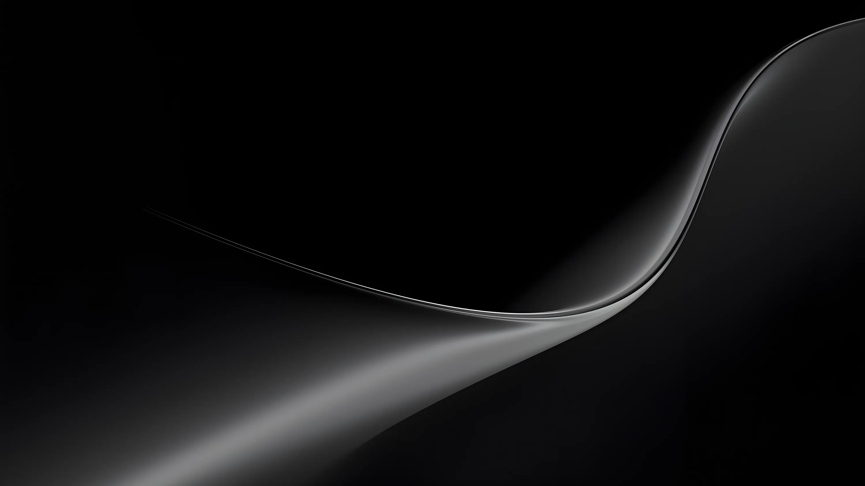A single pale ribbon curves in from the right edge and thins out toward the lower left, the rest of the frame left in deep black.