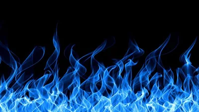 Blue flames lick upward from the bottom of the frame, tongues thinning into smoke well before they reach the empty black top half.