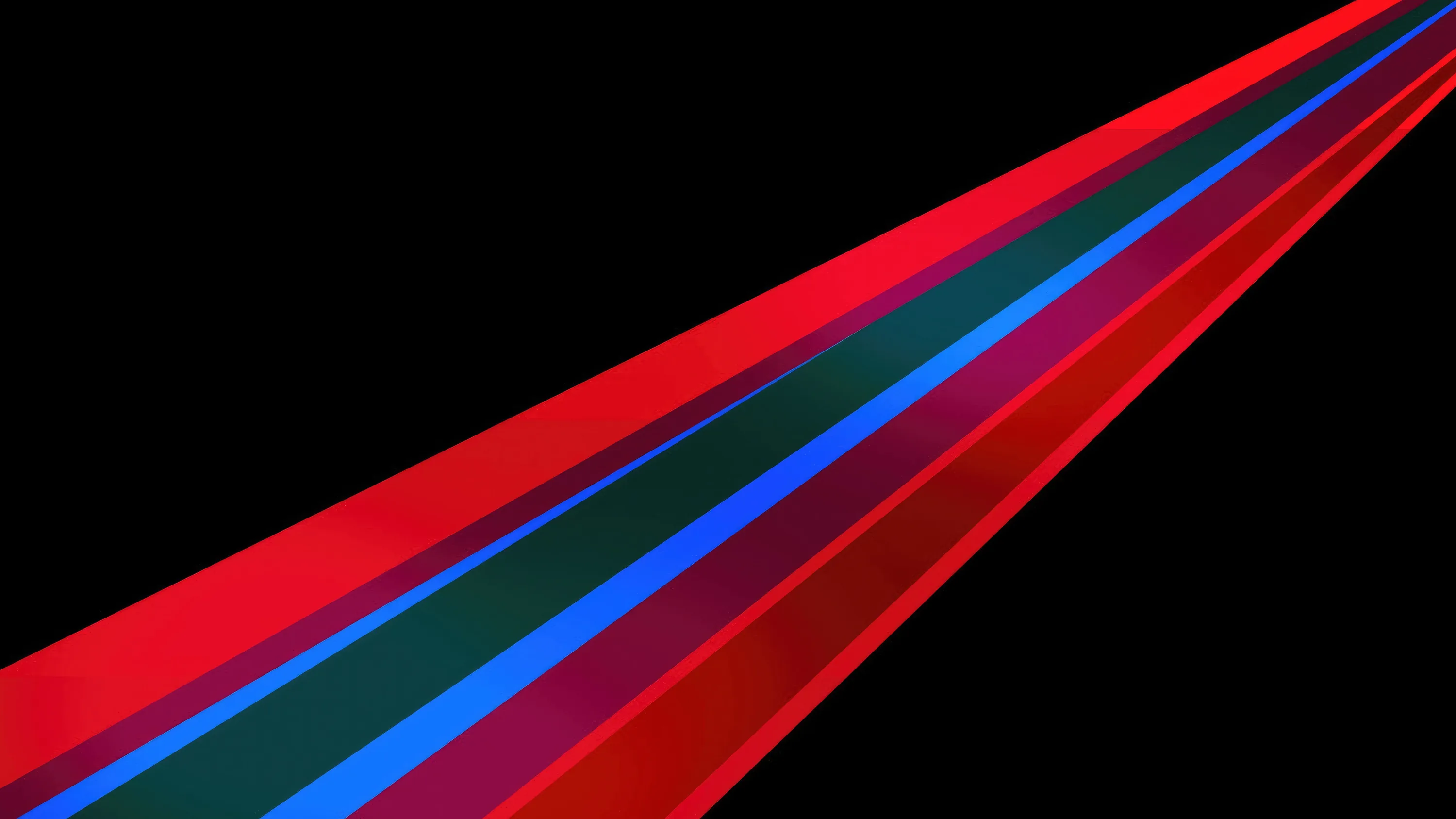 Bands of red, green and blue run from the top right corner down to the lower left, widening as they go and set on flat black.