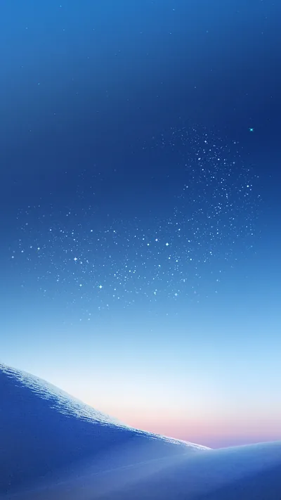 Faint stars scatter over a deep blue sky above a smooth dune ridge, a peach glow on the right horizon; the upper half stays clear for the clock.