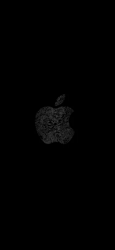 The Apple logo picked out in rough black texture on an otherwise pure black field, visible only where the light grazes it.