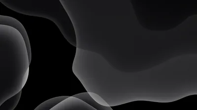 Translucent rounded shapes drift over each other in greys, leaving the lower left corner clear for icons.