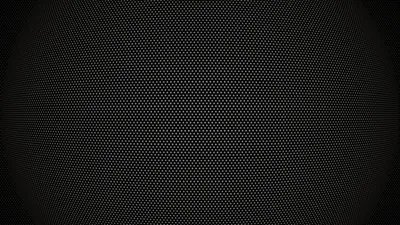 A fine dotted grille covers the whole frame, brightening slightly at the centre like light on perforated metal.