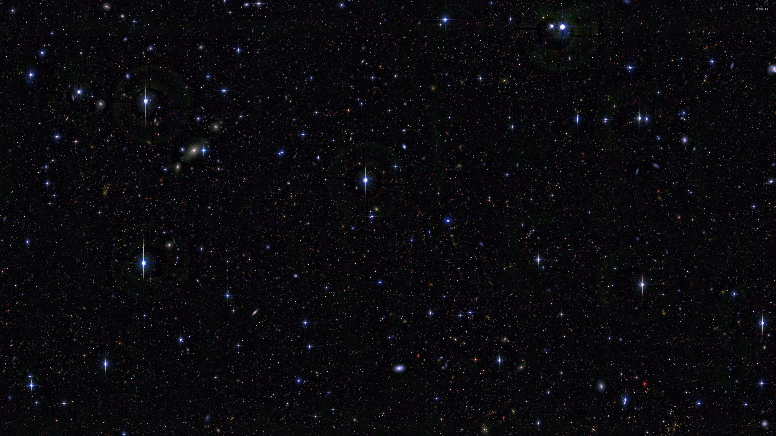 Blue-white points sit widely spaced across an otherwise empty black frame, with one tight knot of them gathered near the top left.