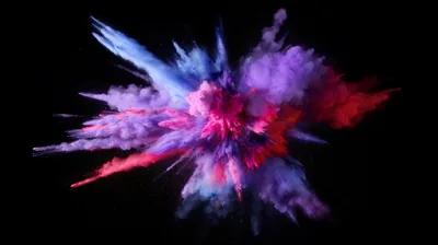 Pink, blue and violet pigment bursts outward from a central point, frozen mid-flight with black in every gap.