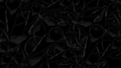 A dense tiled pattern of matte black petals, leaves and round beads, lit from the top so only the rims of each shape separate from the background.