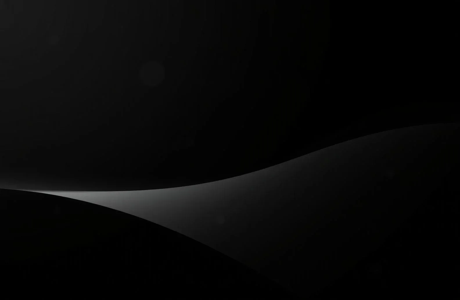 A pale curve sweeps through the lower third and leaves the top two-thirds empty — plenty of clear space for desktop icons.