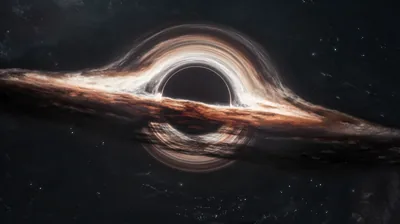 A warm brown dust disc circles the dark sphere edge on, its halo arcing overhead, and both lower corners fall away to plain starry black.