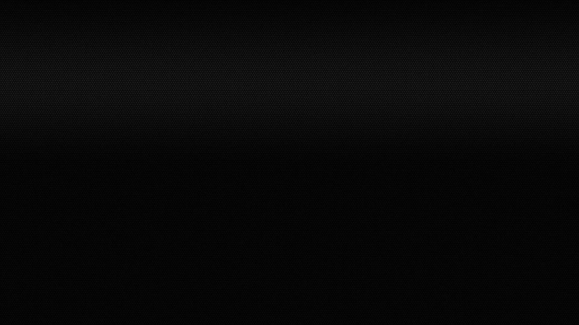 A narrow band of charcoal along the top dissolves into flat black within the first third of the frame.