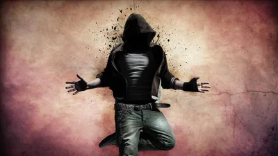 A kneeling figure spreads both arms as the head and shoulders scatter into ink-like particles across a mottled wall.