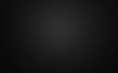 An even textured backdrop with a soft light in the middle, dimming steadily toward the corners.