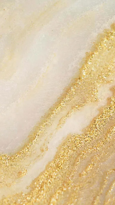 A band of gold glitter cuts diagonally through pale cream marble, leaving the smooth upper-left corner clear for a phone clock.