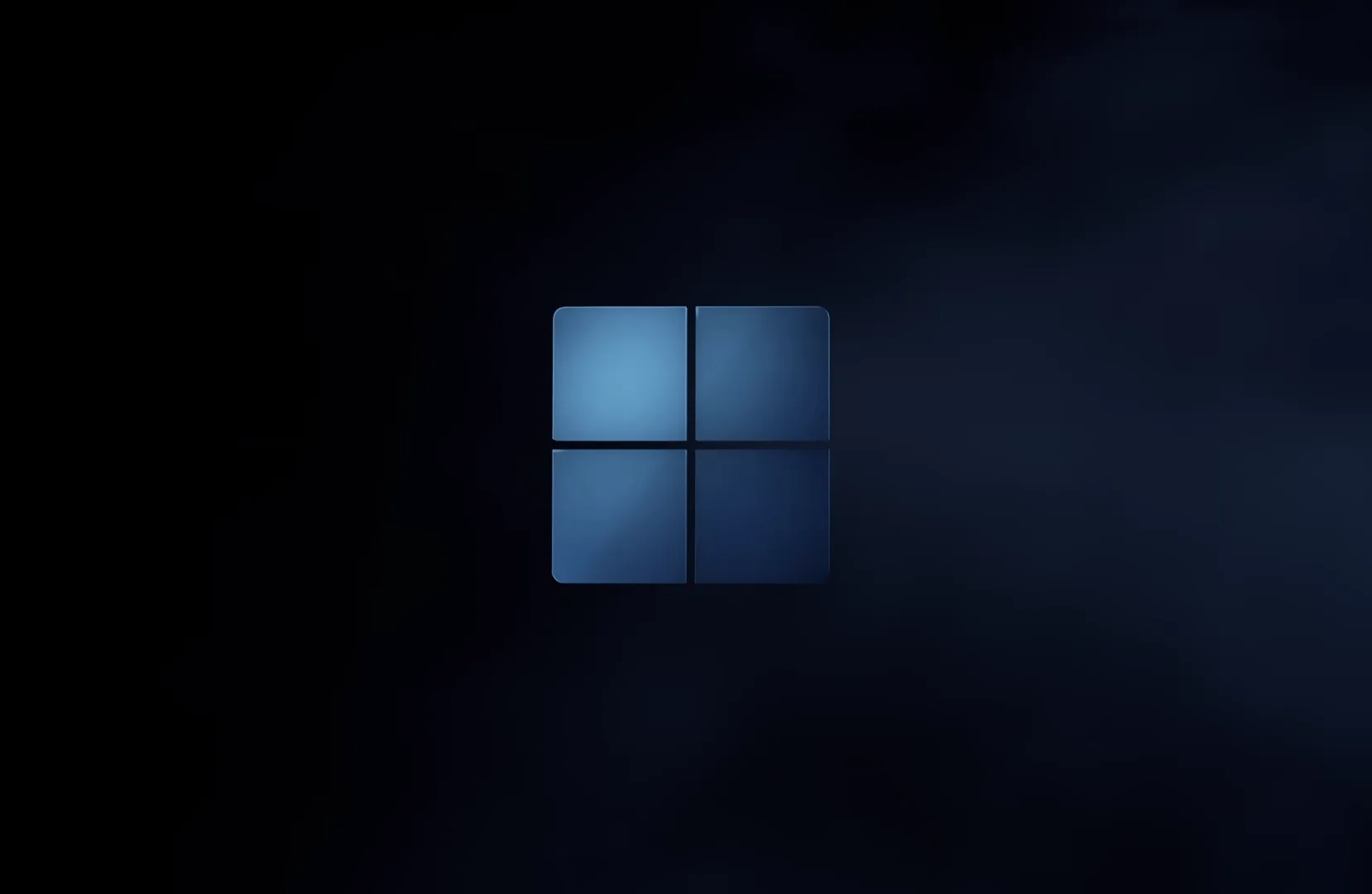 The rounded four-pane mark floats at centre in a drift of navy fog, lit from within so the corners of the frame stay almost black.