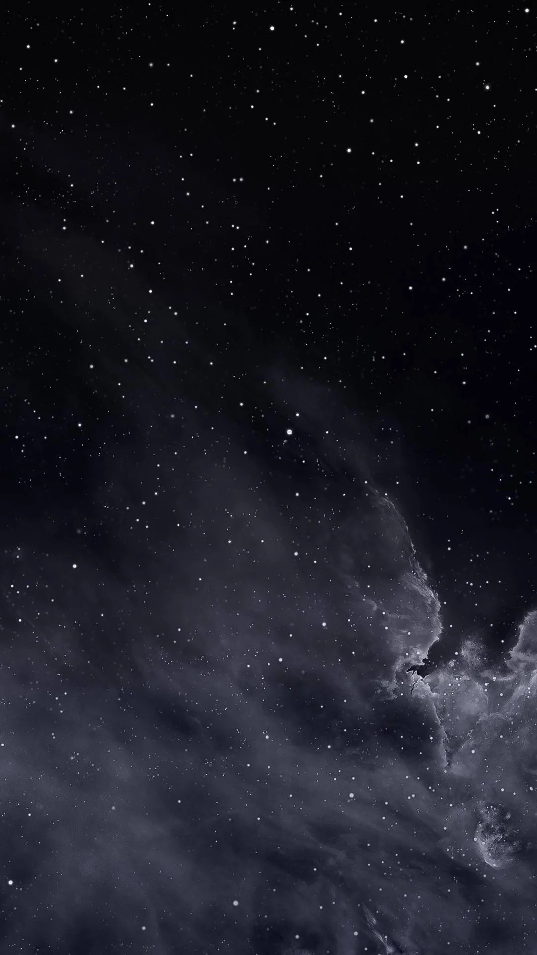 Thousands of stars scatter across a deep navy-black sky while a pale band of cloud drifts up from the lower right, leaving the top clear for icons.