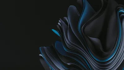 Layered ribbons curl in from the right in graphite and blue, the left third left as empty dark space for desktop icons.