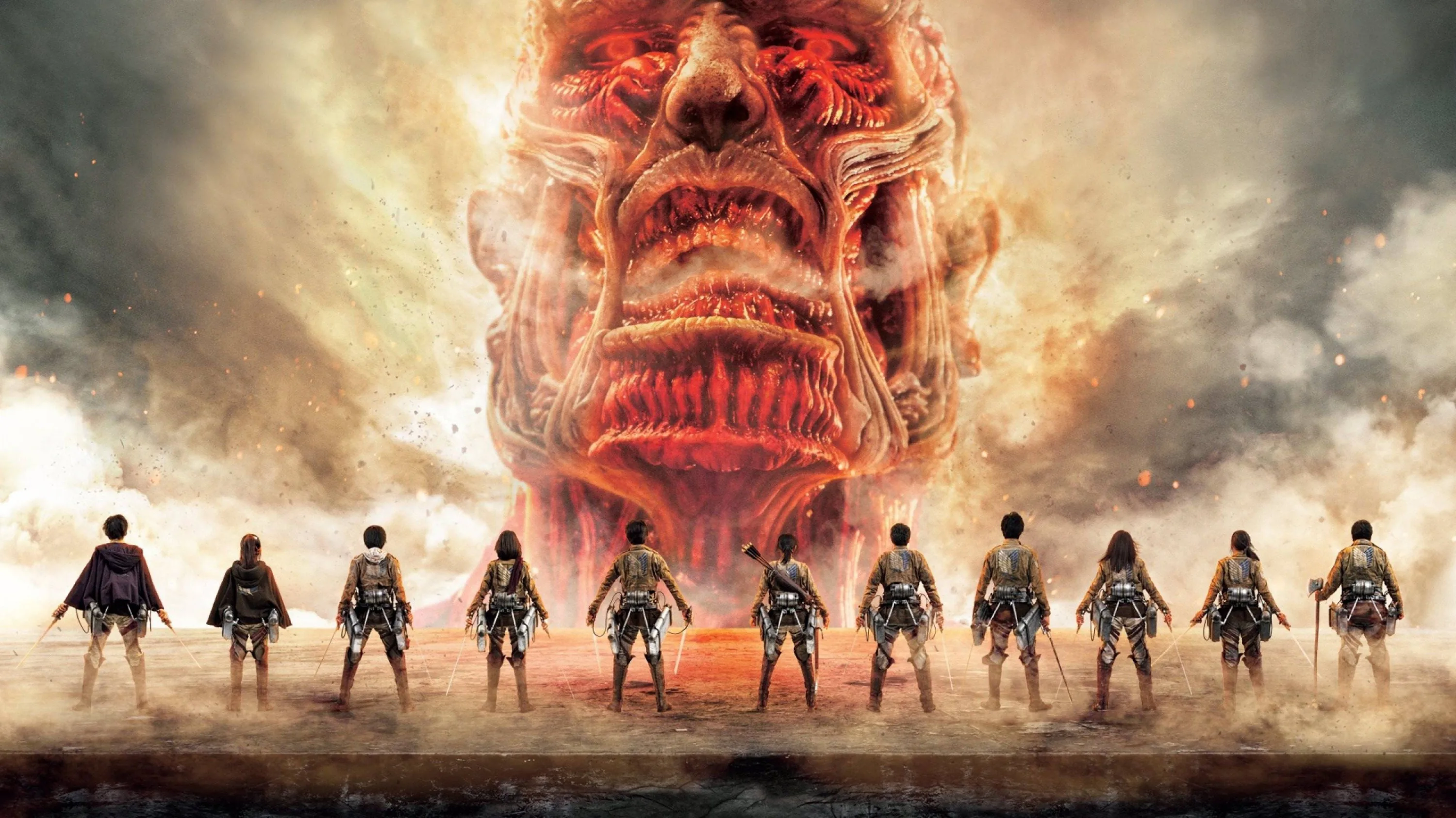 Eleven scouts stand in a row on cracked ground while the enormous grinning face rises through smoke and dust behind them.