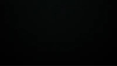 Black covers nearly the entire frame, only a trace of pale dotted shapes surfacing near the top edge — dark enough to sit flat on an OLED screen.