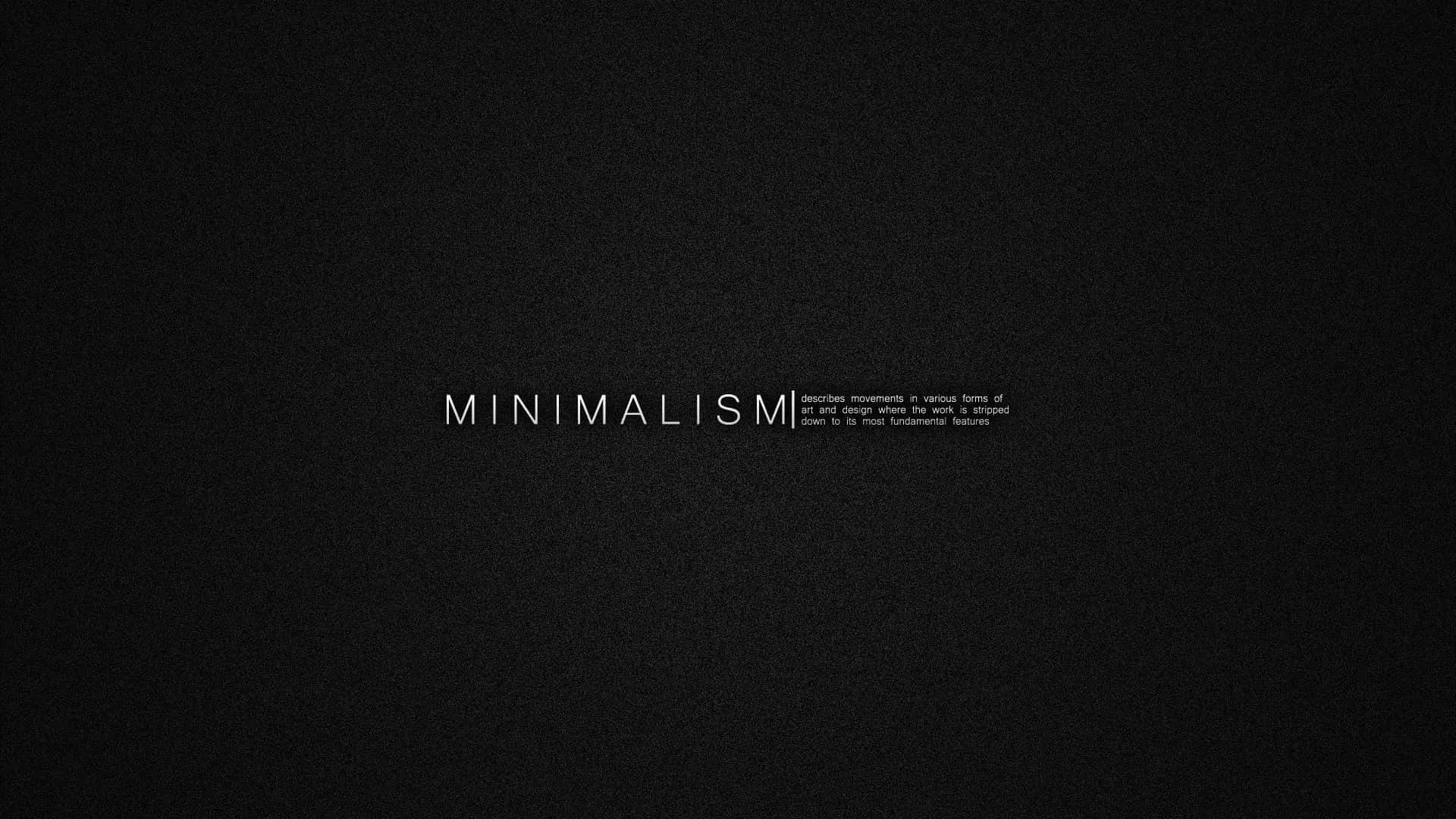 Wide-spaced letterforms sit centred on a finely grained charcoal background with a small paragraph of grey text beside them.