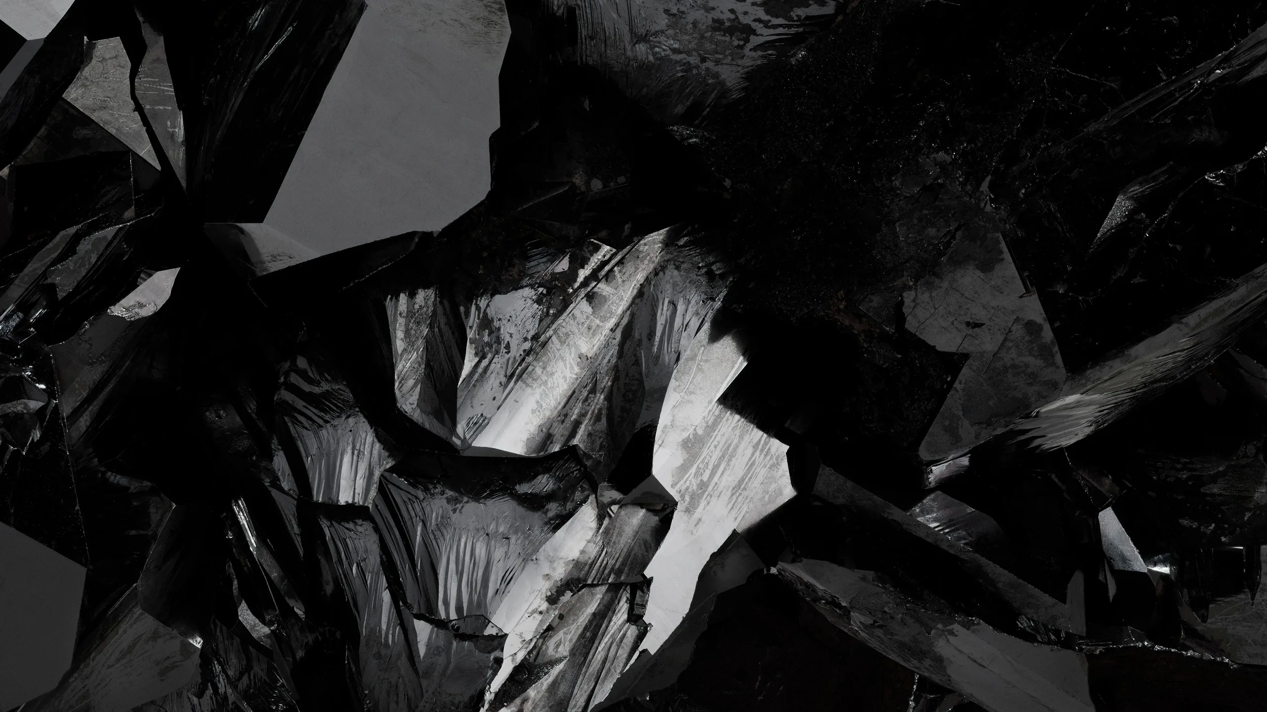 Broken shards catch a hard sidelight against near-black, the sharp white highlights running down the middle of the frame.