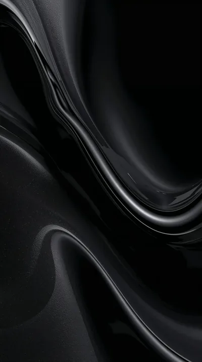 Heavy black fabric folds over itself, one highlight running the length of each ridge and the corners left unlit.