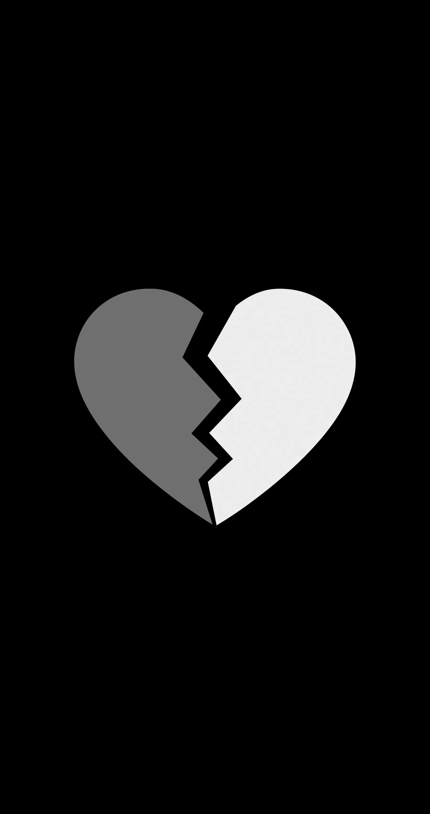 A heart cracks down the middle into a grey half and a white half, floating in tall black space with room to spare.
