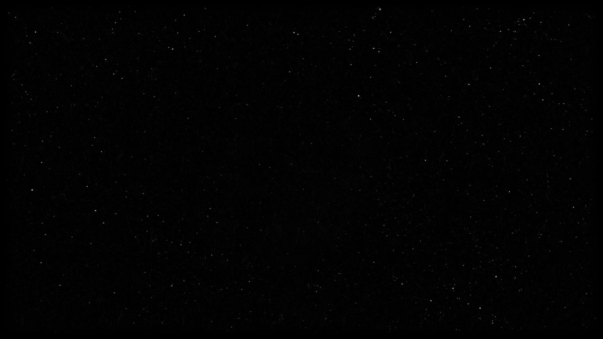 Scattered pinpoint stars over an almost entirely black sky, thick enough near the top to read as haze and empty through the lower middle.