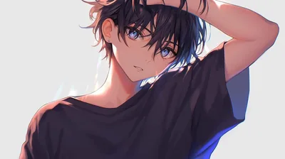 Blue-eyed and in a loose black tee, he lifts one arm to sweep his hair back against a soft off-white studio background.