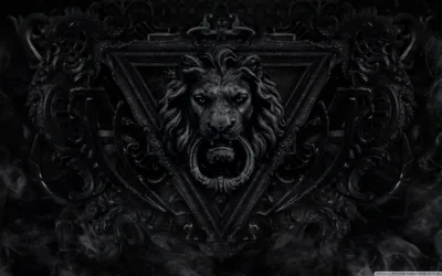 An ornate lion's head with a ring in its mouth sits inside a triangular crest, surrounded by carved scrollwork and smoke.