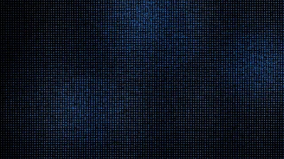 A fine grid of navy dots covers the frame evenly, brightening into a diffuse patch near the top and darkening toward every corner.