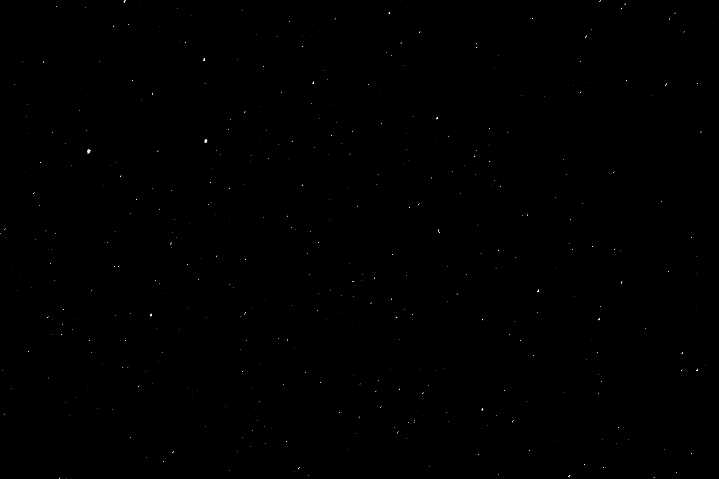 A scattering of small white stars across an almost unbroken night sky, no moon and no horizon, the frame reading as true black on OLED.