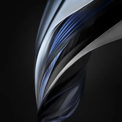 A folded ribbon of steel blue and silver curls up through a charcoal square, the same stock swirl Apple shipped on the iPhone SE, with the lower left kept empty.
