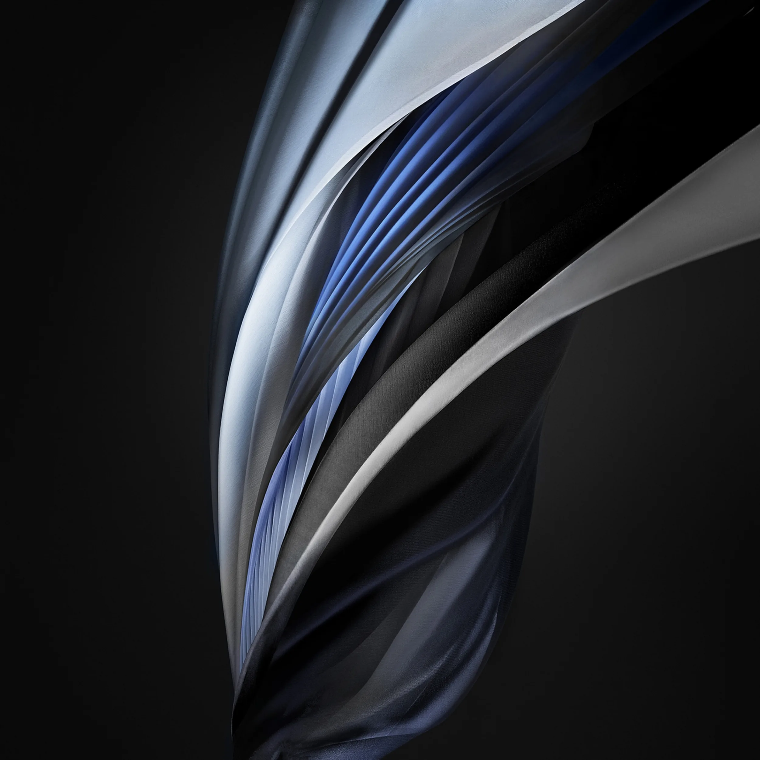 A folded ribbon of steel blue and silver curls up through a charcoal square, the same stock swirl Apple shipped on the iPhone SE, with the lower left kept empty.