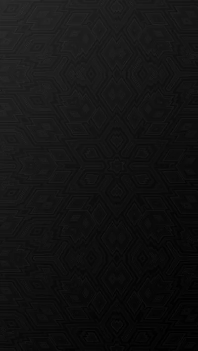 A damask motif is pressed into a matte black surface, barely visible and even from corner to corner.