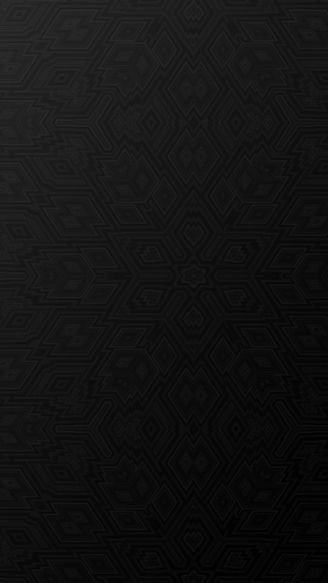 A damask motif is pressed into a matte black surface, barely visible and even from corner to corner.