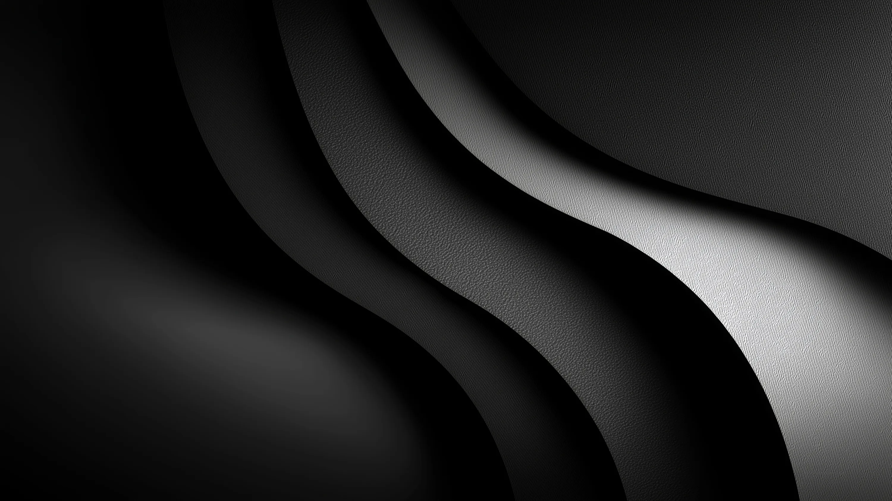 Two wide curves sweep from top to bottom, the gradient running from bright silver along their edges into deep black on the left.
