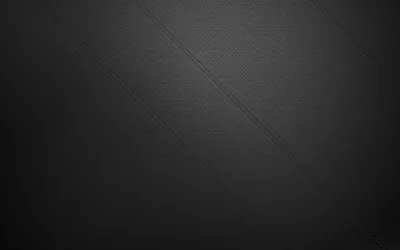 An even weave of dark grey cloth with one barely visible diagonal seam crossing the upper right, the tone lifting slightly towards the top.