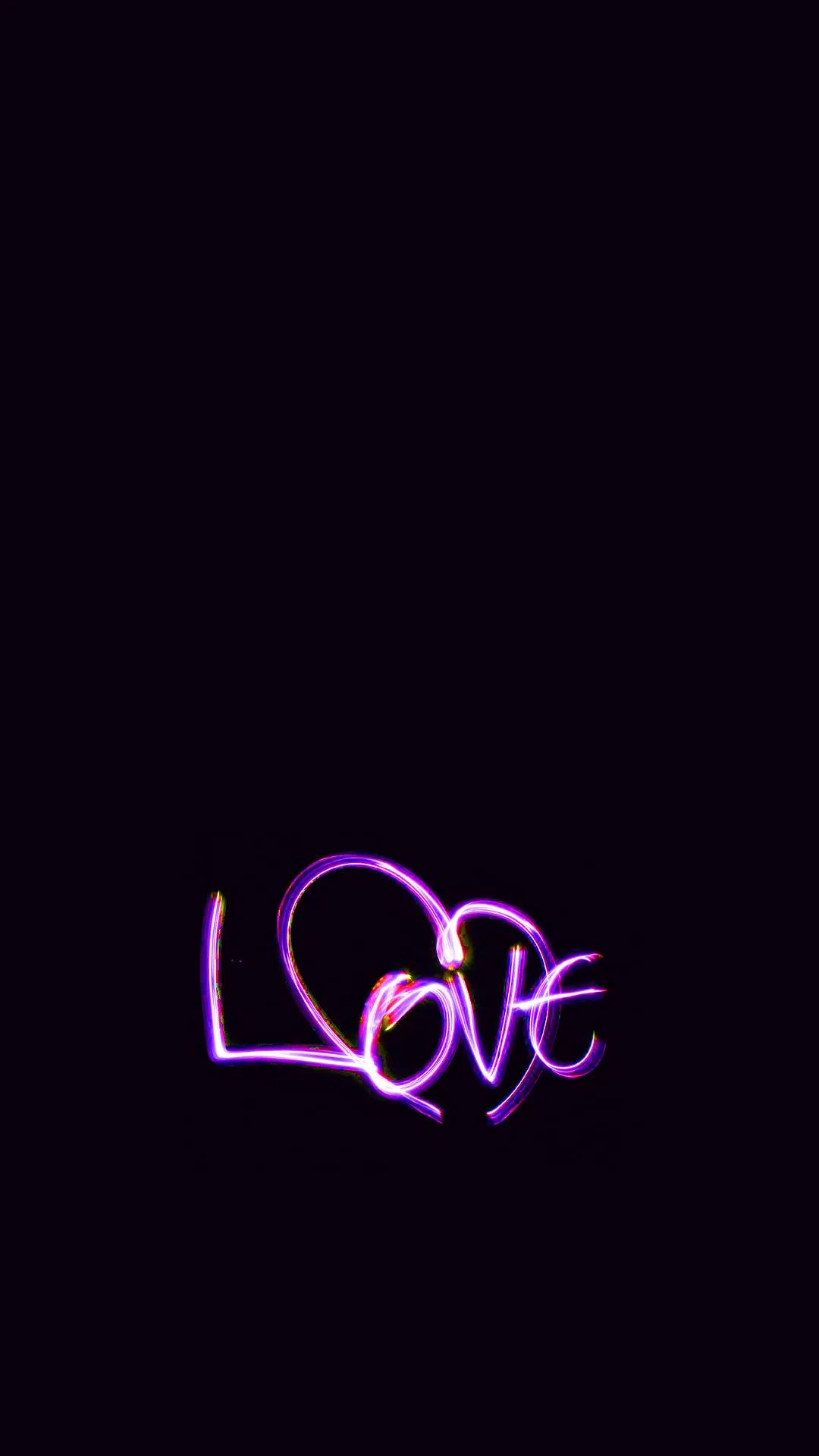The word Love written in glowing violet neon script, placed low on a near-black field with a soft haze around the strokes.