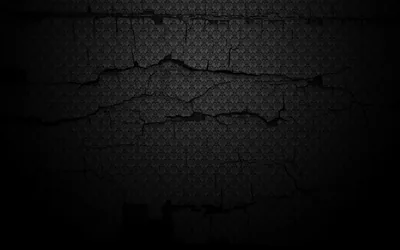 A jagged split runs across a damask-papered wall, plaster broken away along the crack while heavy shadow closes in on all four sides.