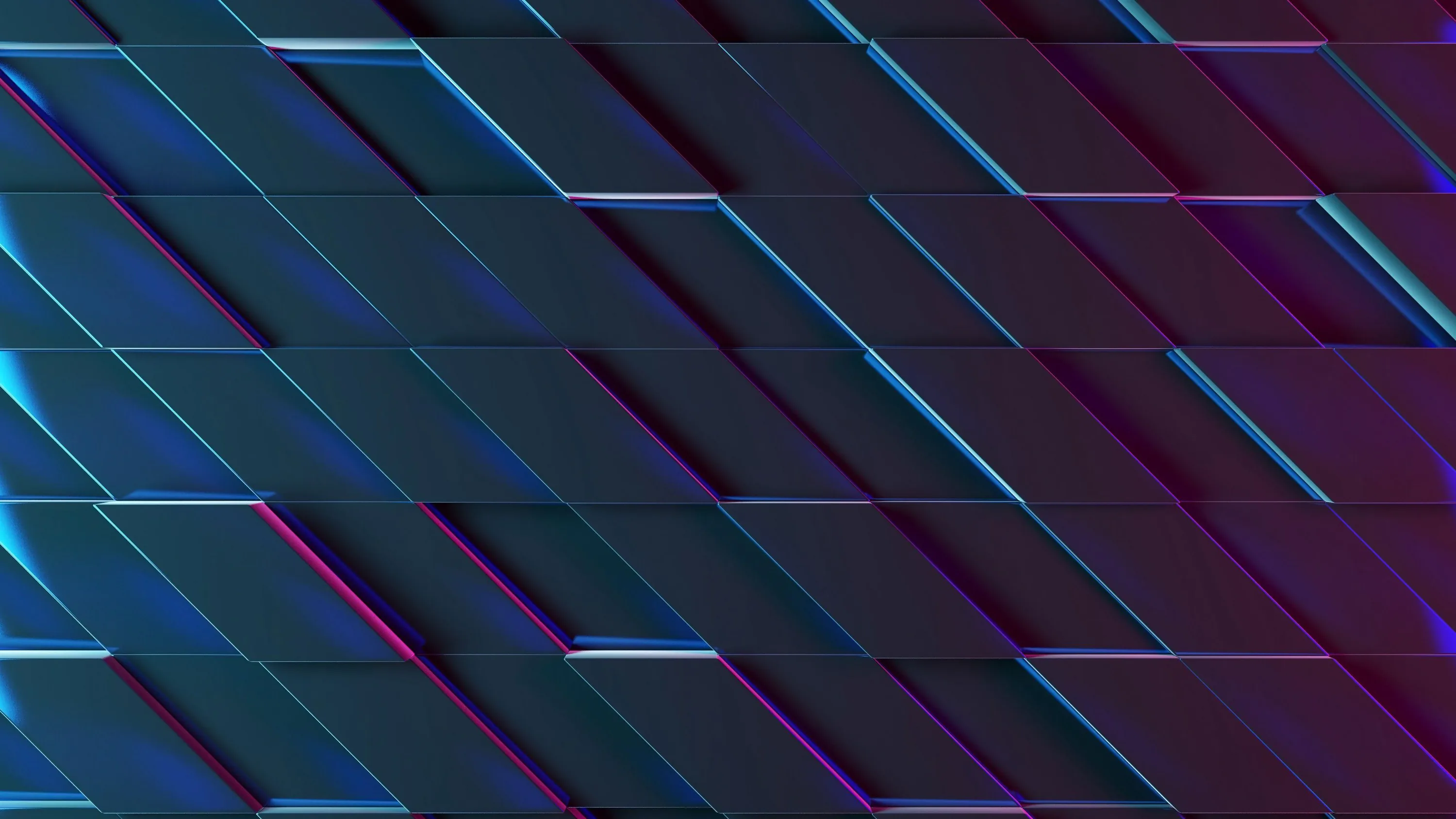 Brushed dark panels sit at a diagonal, each bevel catching a thin line of blue or magenta light.