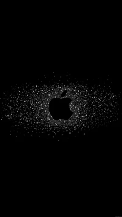 White dust scatters outward from the centre and leaves the Apple silhouette in solid black at the middle, the corners fading to nothing.