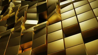 Mirror-finish gold cubes jut from a wall at staggered depths, lit from the upper right so each face splits into light and shadow.