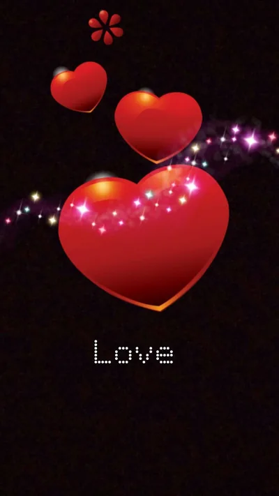 Three glossy red hearts float over black with a sweep of sparkles behind them and the word Love in pixel type below.