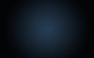 A soft blue bloom sits just above the centre of a very dark navy field, dropping away to near-black at all four corners.