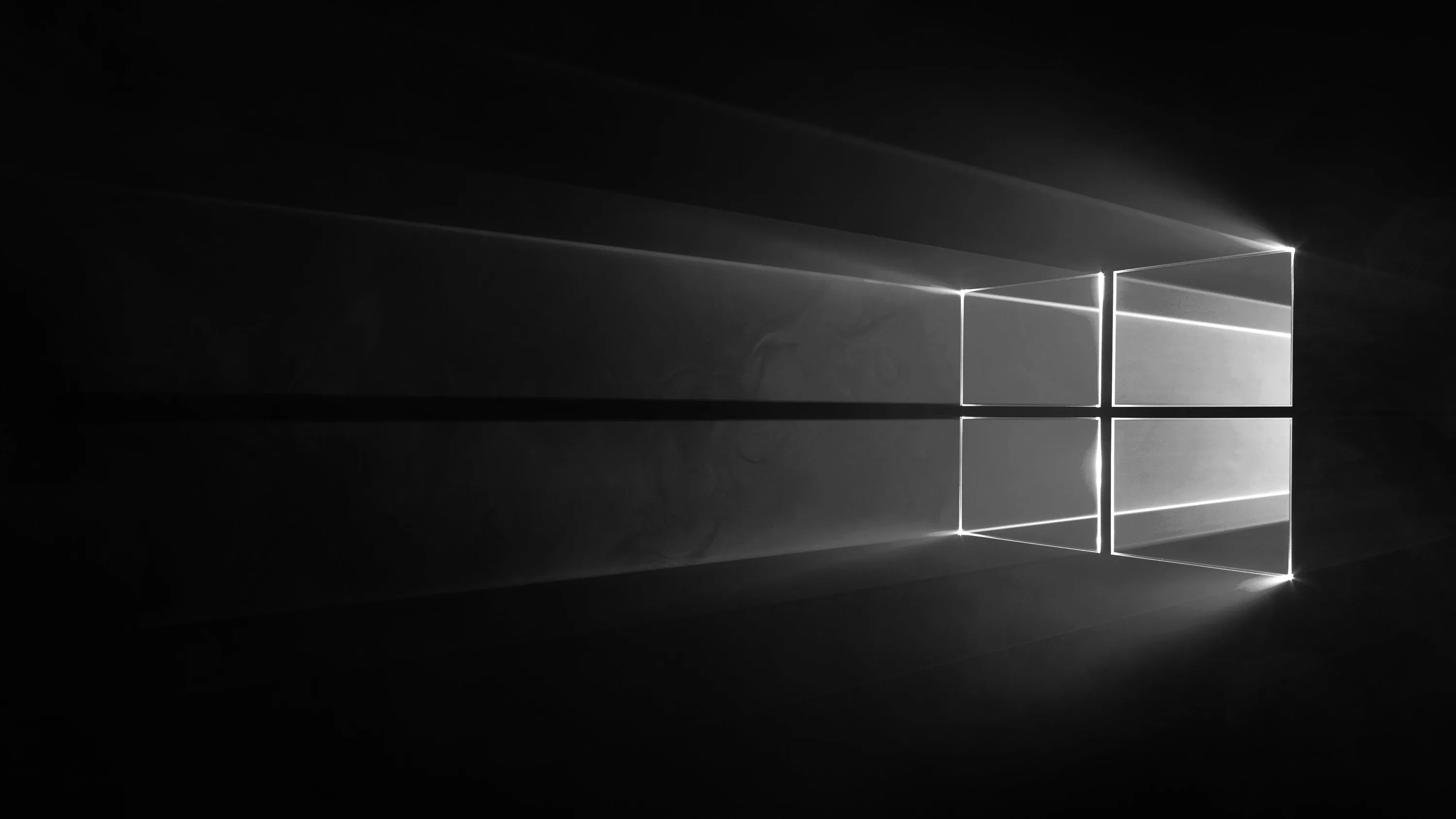 The Windows window rendered as a pane of light in a dark room, casting long beams across the floor.