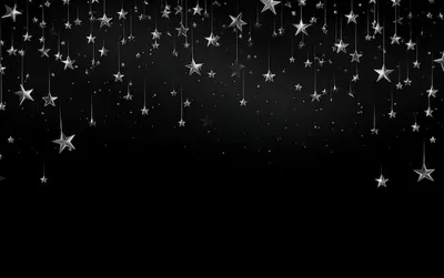 Silver stars strung on fine threads crowd the top of the frame and thin out as they fall, with loose sparkles caught in between.