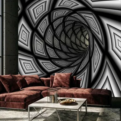 An op-art spiral tunnel in black and white pulls the eye to the centre of the wall, framed by two maroon velvet sofas.
