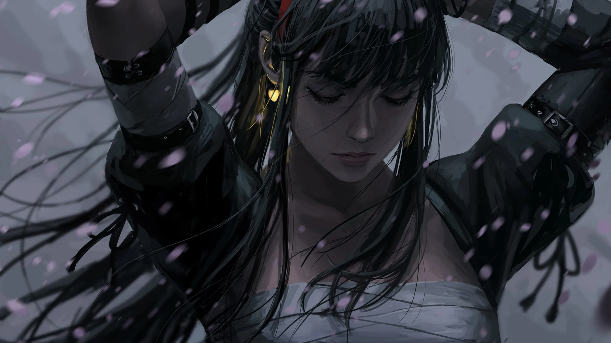 Arms lifted behind her head, black hair loose over bare shoulders, pale petals drifting across a cold grey-blue background.