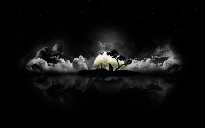 The moon burns through banked cloud behind a single bare tree on a spit of land, the whole scene repeated upside down in the water below.