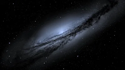 A grey spiral galaxy leans across the frame, dark dust lanes crossing its pale blue core while the surrounding black stays flat enough for desktop icons.
